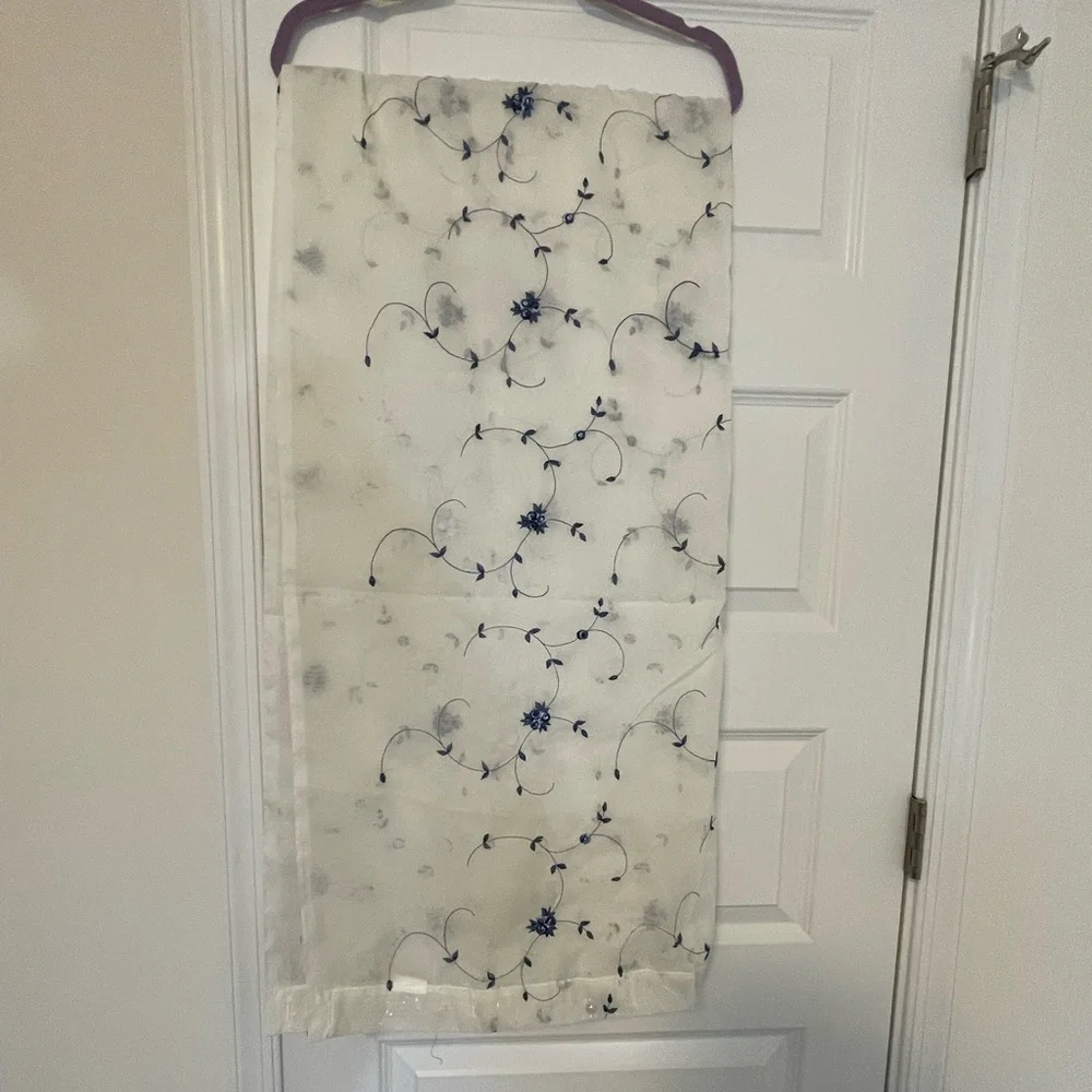 White Sheer Shower Curtains with a pattern delicate blue flowers through out